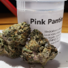 Pink Panties Strain exhibits vibrant hues of pink and purple amidst its densely packed buds. These flowers are generously coated with glistening...